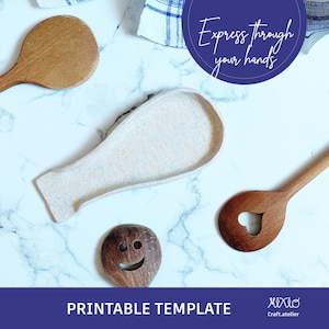 May include: Printable template for a spoon rest, with the text "Express through your hands" on a blue circle. The template is on a white marble surface with three wooden spoons.