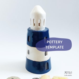 May include: A ceramic lighthouse-shaped candle holder in white, navy blue, and white. The lighthouse has a conical top and rectangular cutouts. The text "POTTERY TEMPLATE" is on a blue oval. Seashells are at the base.