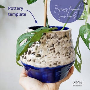 May include: A handcrafted pottery planter with a textured, off-white upper section and a vibrant blue base. The planter holds a green plant with large leaves. Text on the image reads "Express through your hands" and "Pottery template".