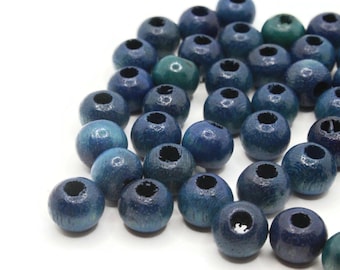 May include: A collection of blue wooden beads with a hole in the center. The beads are round and have a smooth, polished finish.