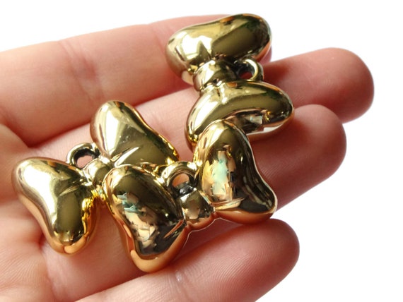 10 Bow Charms antique gold tone GC244