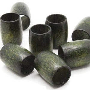 May include: A set of ten green wooden beads, each with a hole in the center. The beads are cylindrical and have a slightly rough texture.