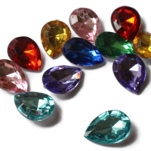 May include: Assortment of pearlescent teardrop-shaped glass rhinestones in various colors, including pink, red, yellow, green, blue, purple, and teal.