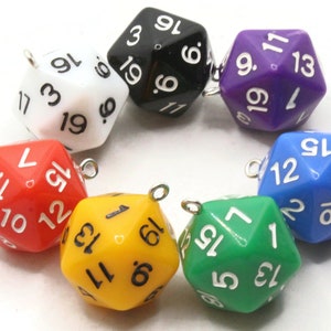 May include: A set of eight colourful, numbered, d20 dice with a silver charm attached to each. The dice are arranged in a circle on a white surface.