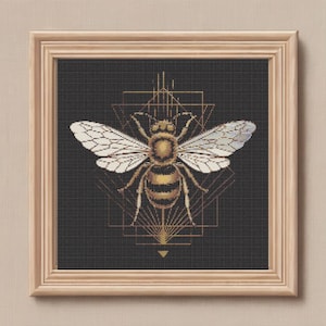 May include: A gold bee with black stripes is centered in a geometric design of gold lines on a black background. The bee has transparent wings.