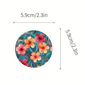 May include: Round floral design with hibiscus flowers in shades of red, orange, and yellow, surrounded by teal leaves. The design is 2.3 inches in diameter. The text on the image reads "5.9cm/2.3in".