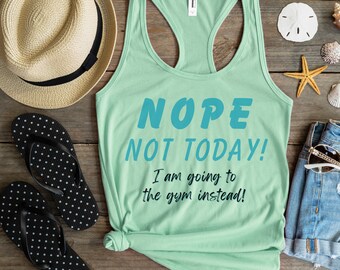 May include: A light green tank top with the text "NOPE NOT TODAY! I am going to the gym instead!" in blue lettering.
