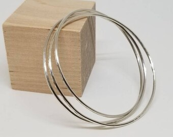 Three linked sterling bangle bracelets