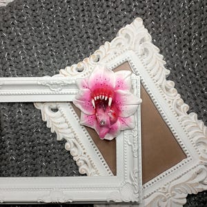 Toothy flower brooch from polymer clay