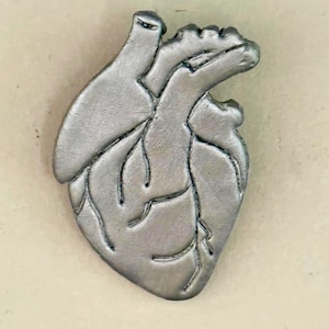 Handcrafted silver anatomical heart wall sculpture