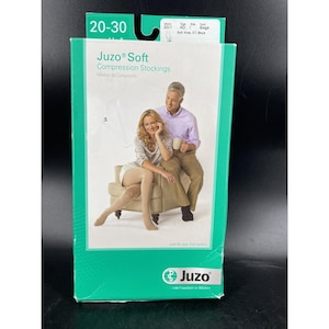 May include: A box of Juzo Soft Compression Stockings, with a 20-30 mmHg compression level. The box features a photo of a woman wearing the stockings and sitting on a chair. The text on the box reads "Juzo Soft Compression Stockings" and "Medias de Compresión".