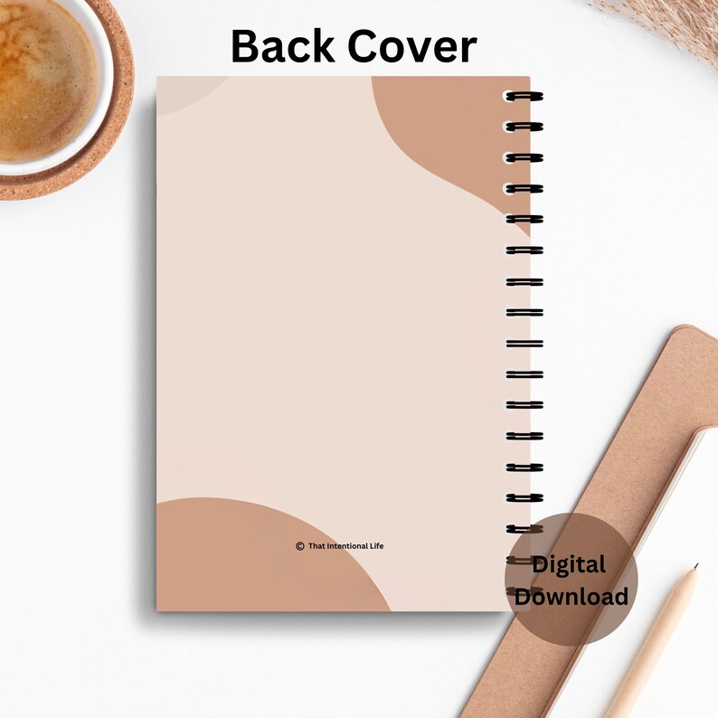 The image shows the backside of the planner cover worded Blessed & Highly Favored with elegant writing and colorful pictures that catch your eye.