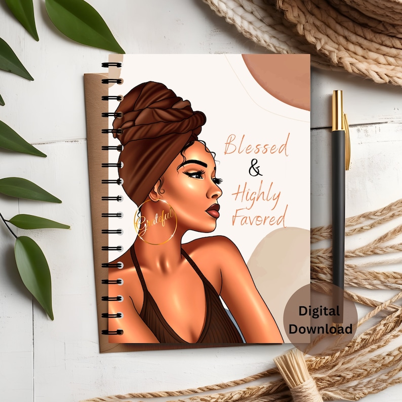 The image shows the front cover of the black woman journal worded Blessed & Highly Favored with cool writing and colorful pictures that catch your eye.