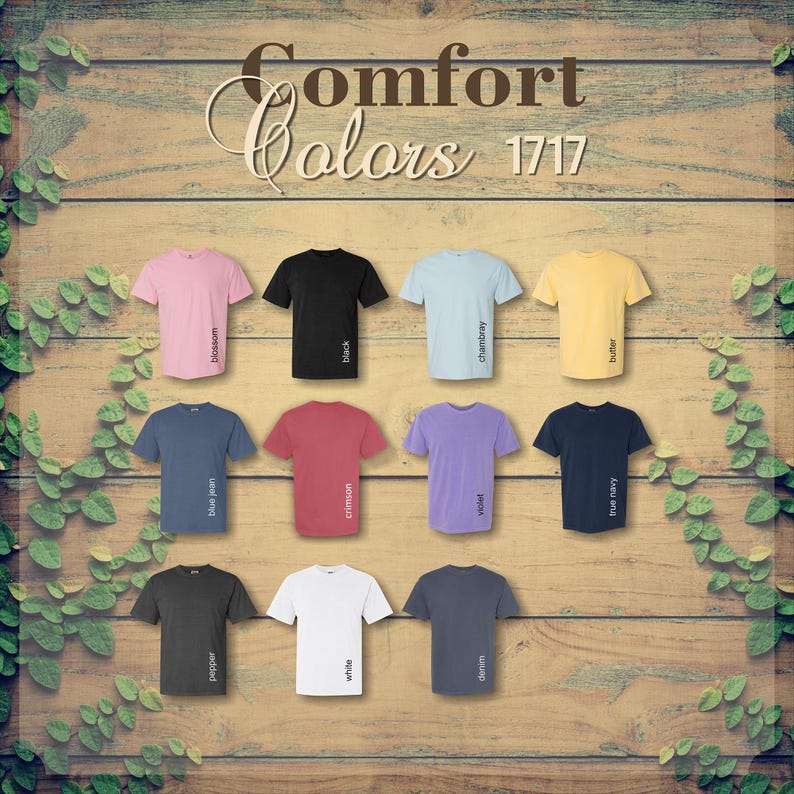 May include: A collection of short-sleeved t-shirts in various colors, including pink, black, blue, red, purple, and yellow. Each shirt has a different color name printed vertically on the side. The text "Comfort Colors 1717" is at the top.