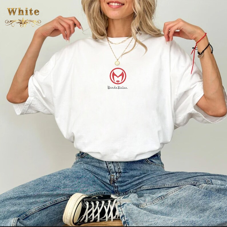 May include: White t-shirt with a red circle logo featuring a stylised female face and the text "Wanda Vision".