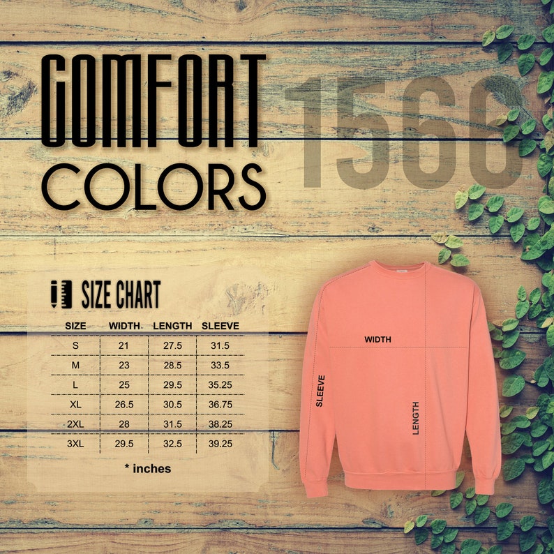 Op de afbeelding: Een koraalkleurige sweatshirt met een maattabel en de woorden "COMFORT COLORS" en "1568" in het zwart. De maattabel toont de afmetingen in inches voor breedte, lengte en mouwlengte voor de maten S t/m 3XL.