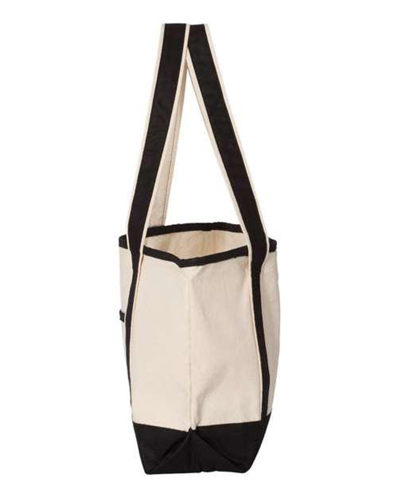 May include: A white canvas tote bag with black trim and handles. The bag has a large main compartment and a smaller pocket on the front.