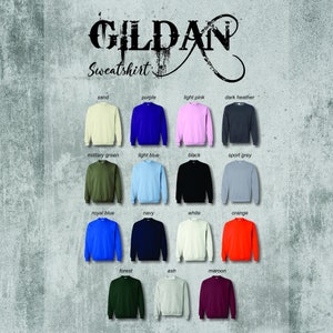 May include: A color chart of Gildan sweatshirts in various colors, including sand, purple, light pink, dark heather, military green, light blue, black, sport grey, royal blue, navy, white, orange, forest, ash, and maroon.