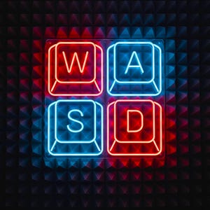 Puede incluir: Letrero de neón con las teclas WASD en rojo y azul. Las teclas están dispuestas en un cuadrado, con las teclas W y D en rojo y las teclas A y S en azul. El fondo es una superficie oscura y texturizada.