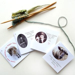 May include: Four white cards with black and white images and text. The text on the cards reads "Hand Knit Garment to Keep You Warm", "From One Hipster to Another", "Hand Knit Garment to Keep You Warm", and "Russell Crowe Didn't Knit This One But I Did".