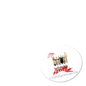 May include: A white circle with a red and white umbrella, a group of people in black and white clothing, and the text "buffalogirls design" in red and black. The text "buffalogirlsdesign.com" is in black at the bottom of the circle.