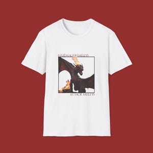 May include: White t-shirt with a black and red dragon graphic and the text "NAPE MAGON MELEYS" and "ATTACK MELEYS".