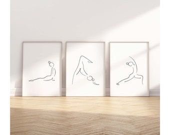 May include: Three black and white line drawings of people in yoga poses on white backgrounds framed in light wood frames.