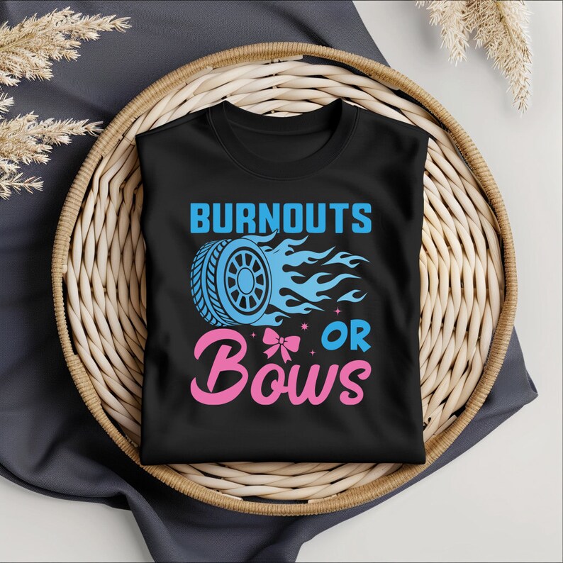 May include: Black t-shirt with a blue tire and flames graphic and the text "Burnouts or Bows" in pink.