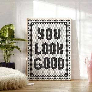 May include: Black and white mosaic tile art print with the text "YOU LOOK GOOD" in a black frame.