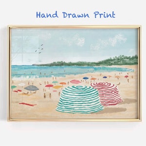 May include: A hand-drawn print of a beach scene with colorful striped umbrellas and people on the sand. The sky is blue with white clouds and there are birds flying overhead. The text "Hand Drawn Print" is at the top of the image.