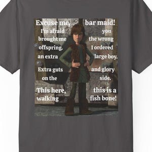 May include: Dark gray t-shirt featuring a cartoon image of a character with text that reads "Excuse me, bar maid! I'm afraid you brought me offspring. I ordered a large boy. Extra guts on the and glory side. This here, walking, this is a fish bone!"