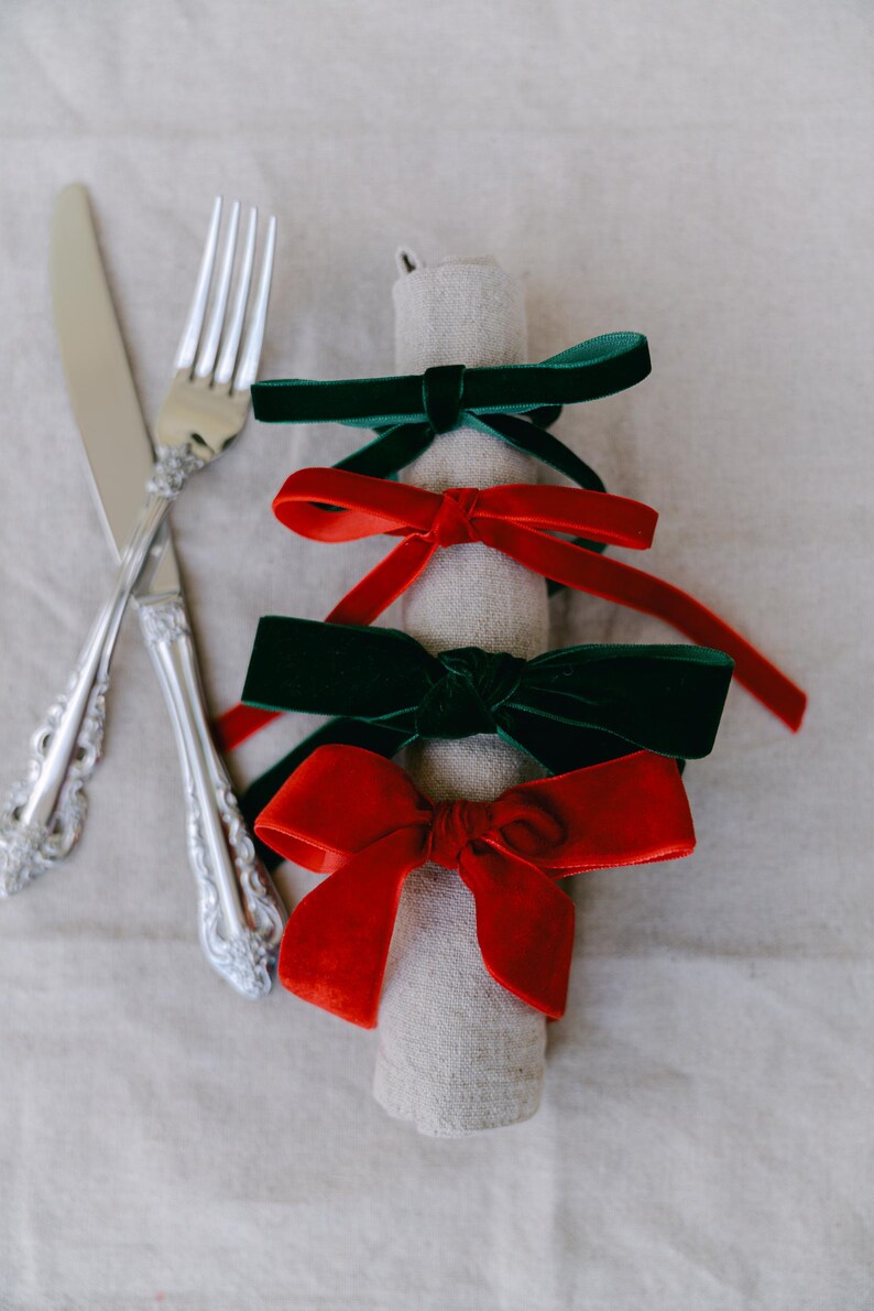 Multiple color, bow napkin rings in a Christmas table setting.