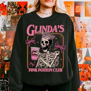 Glinda’s Pink Potion Club Sweatshirt, Wicked Defying Gravity Hoodie, Broomstick Magic Wand, Wizard Movie Fan Gift, Halloween Sweatshirt