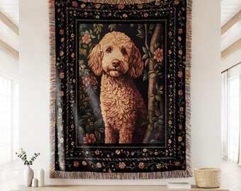 May include: A woven tapestry featuring a golden doodle dog portrait. The dog is surrounded by floral and foliage elements, set against a dark background. The tapestry has a fringed border and is displayed on a wall.