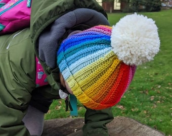 Rainbow beanie with cream pom