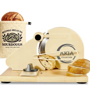 May include: A white ceramic mug with a black handle and the text "But First, Coffee" in a black, handwritten-style font. The mug is on a white surface.