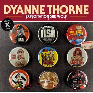 May include: A selection of nine circular pin badges featuring images of Dyanna Thorne from the film "ILSA, She Wolf of the SS." The badges display various designs, including text and illustrations.