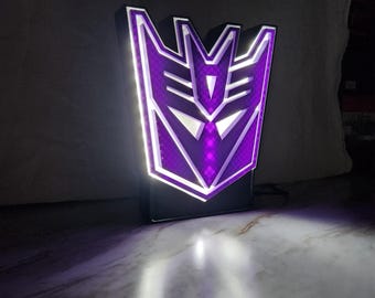 Décoration murale caisson lumineux Transformers Decepticons | Présentoir de fan art, robot déco mural, veilleuse pour enfants et collectionneurs