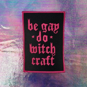 May include: Black patch with pink text that reads "be gay do witch craft".