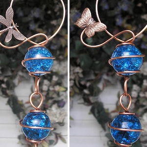 May include: Copper wire wind chime with blue glass orbs and dragonfly and butterfly accents.
