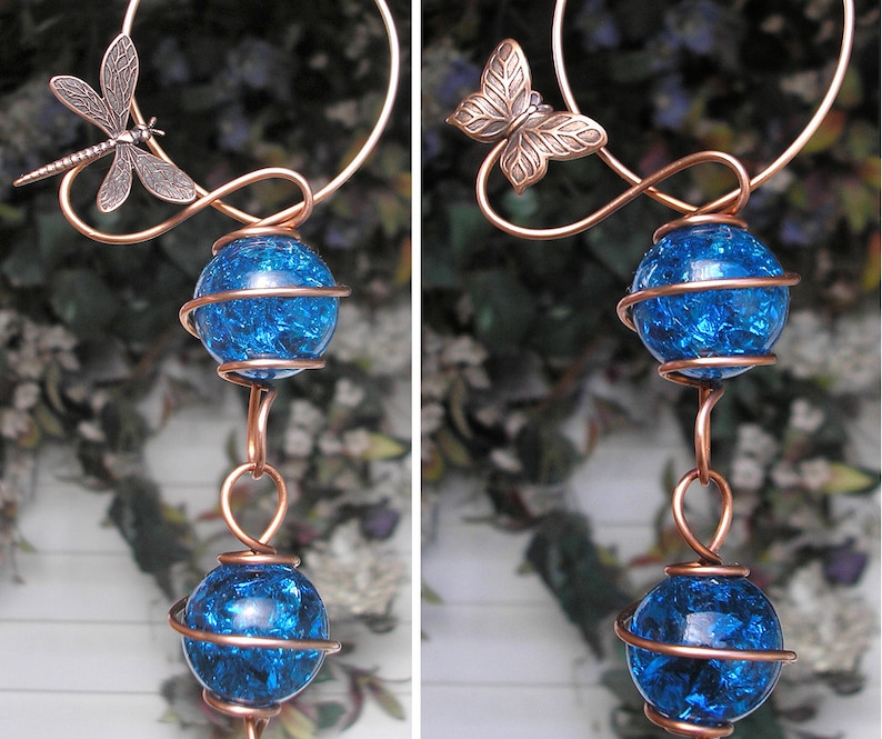 May include: Copper wire wind chime with blue glass orbs and dragonfly and butterfly accents.