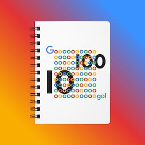 May include: A white spiral-bound notebook featuring a graphic design of the word Google spelled out with colourful rings in blue, red, yellow, and green. The design incorporates large black letters and numbers integrated into the ring pattern.