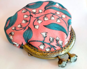 Coin purse with lily of the vally on pink and teal with kiss lock frame and crystal bud clasp