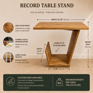 May include: A solid wood record table stand with a C-shaped profile. Dimensions are 21.25 inches wide, 20.8 inches high, 13.77 inches deep, and 8.26 inches at the base. It features a storage section for up to 50 records and supports 15.43 lbs.