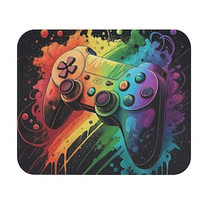 May include: A colorful, artistic mousepad featuring a video game controller. The controller is painted with a rainbow gradient, with a black background and colorful paint splatters. The controller has buttons and joysticks.
