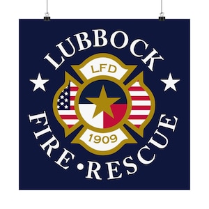 May include: A navy blue poster featuring the Lubbock Fire Rescue emblem. The emblem is a gold Maltese cross with the text "Lubbock Fire Rescue" in a circular pattern. The center of the cross features a gold star and the Texas flag.