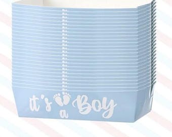 May include: A stack of light blue paper containers with white horizontal lines. The phrase "it's a Boy" is printed in white script on the front, along with baby footprints. These containers are ideal for a baby shower.