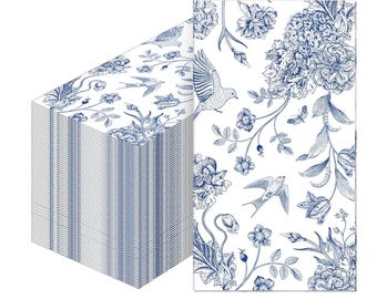 May include: A stack of white paper napkins featuring a blue floral and bird design. The pattern includes detailed illustrations of flowers, birds, and butterflies. The napkins are stacked neatly, showcasing the intricate design.