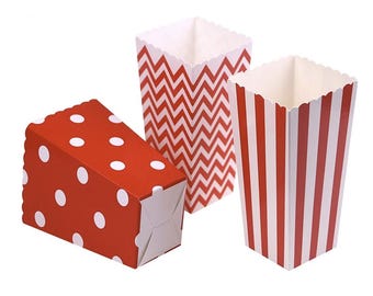 May include: Three decorative popcorn boxes in red and white patterns. One box features white polka dots, another has a zigzag design, and the third has vertical stripes. All boxes have a scalloped top edge.