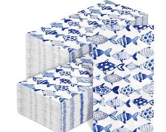 May include: Stacks of white paper napkins with a blue fish pattern. The fish designs vary, with stripes, dots, and solid blue shapes. The napkins are rectangular and stacked neatly.